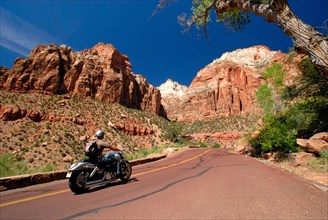 Motorcyclist riding a Harley Davidson on the Zion-Mount Carmel Highway