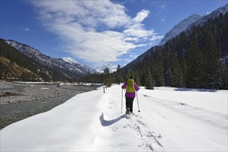 Snowshoe walkers at Rissbach stream