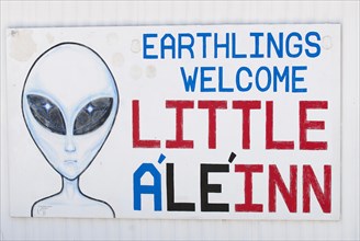 Sign 'Earthlings welcome' of the 'Little A'Le'Inn' pub