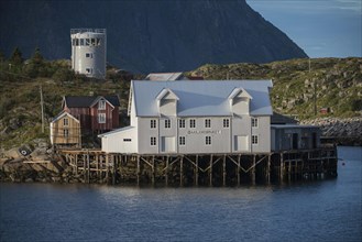 White warehouse by the fjord