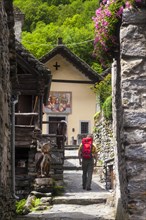 A man hiking in the village of Foroglio