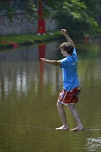 Boy balancing on a slackline