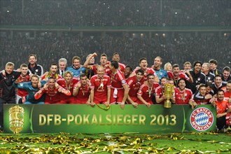 FC Bayern celebrating their triple victory
