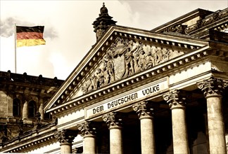 German flag flying at the Reichstag Building of the German Federal Parliament