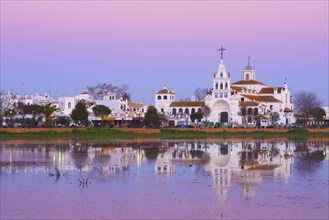 El Rocio village and Ermita del Rocio hermitage at sunset