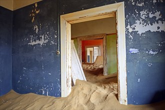 Room in a house that has been filled by desert sand