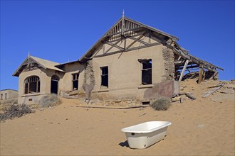 House that has been filled by desert sand