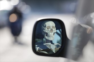 Skeleton at the wheel of a car