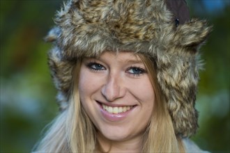 Young woman wearing a fur hat