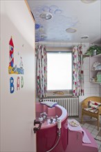 Bathroom with a birthing bath in a maternity ward