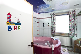 Bathroom with a birthing bath in a maternity ward