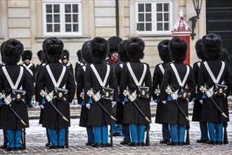 Changing of the guard ceremony in front of the Royal Palace Amalienborg with the Royal Life Guards