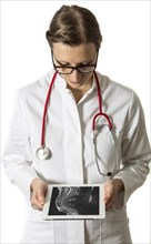 Female doctor holding a tablet computer
