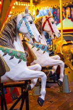 Wooden horses on a historic funfair carousel