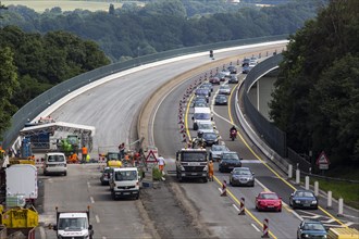 Construction and slow-moving traffic on a motorway construction site on the A52 motorway