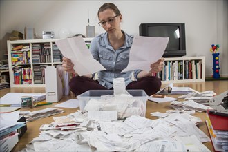 Woman sorting documents