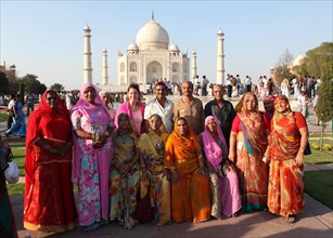 Indian tourist group posing in front of the Taj Mahal