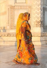 Two Indian women in saris at the Taj Mahal