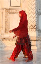 Two Indian women in shalwar pants at the Taj Mahal