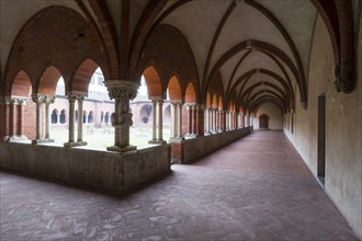 Cloister with a knotted pillar of the Gothic basilica
