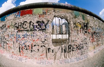 View of the perforated Berlin Wall from the West