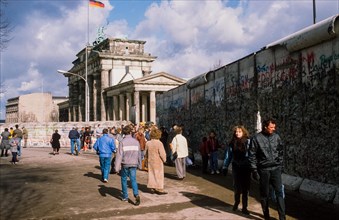 Flag of the GDR waving behind the quadriga on Brandenburg Gate