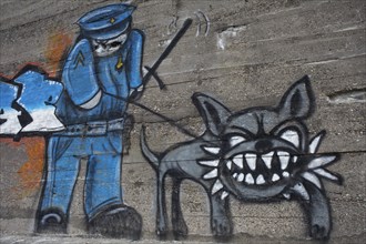Policeman with a tough dog