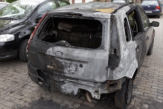 Burnt out Ford Fiesta in a car park