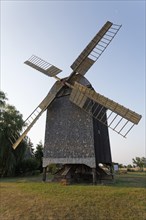 Historic post windmill with wooden shingle cladding