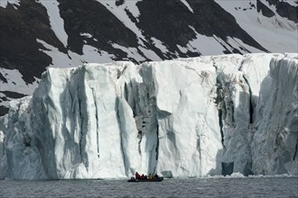 Zodiac inflatable boat during an expedition cruise in front of Samarinbreen Glacier