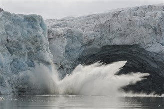 Glacial ice avalanche at the glacial portal of Samarinbreen Glacier
