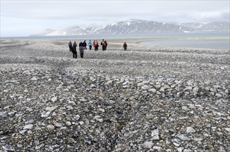 Hikers in the Arctic eis desert