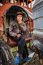 Rickshaw driver takes a rest