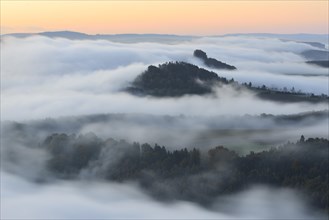 Zirkelstein Mountain and Kaiserkrone Mountain in the morning mist
