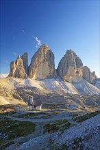 Chapel of Dreizinnenhuette or Three Peaks Alpine hut in front of the north face of the Three Peaks