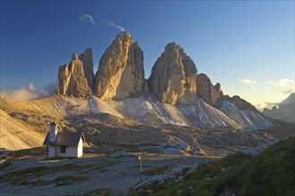 Chapel of Dreizinnenhuette or Three Peaks Alpine hut in front of the north face of the Three Peaks