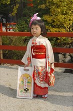 Girl wearing a festive kimono at the Shichi-go-san festival or Seven-Five-Three festival