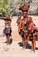 Three traditionally dressed Himba women