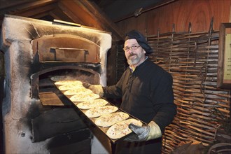 Tarte flambee baker at the Medieval Market