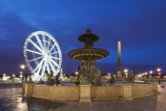 Fountain on Place de la Concorde square in front of a ferris wheel and an obelisk