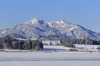 Frozen Hopfensee Lake with Mount Edelsberg and Mount Alpspitz