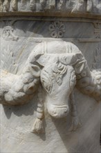 Cow head relief on a pillar