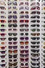 Sunglasses in a display rack