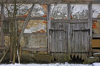 Rotten door of an old timber barn