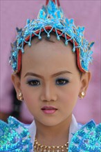 Buddhist girl dressed up to celebrate the novitiation ceremony