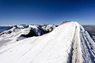 Mountain climber on the summit of Monte Cevedale