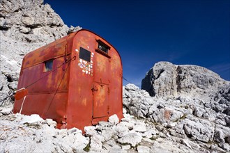 Hut on Bivouac Fiamme Gialle in front of the summit of Cima Vezzena Mountain