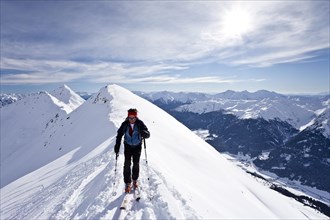 Cross-country skier ascending Ellesspitze Mountain