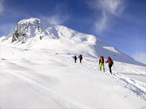Cross-country skiers ascending a mountain