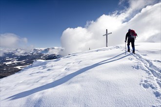 Winter hiker during ascending Schwarzhorn Mountain on Jochgrimm